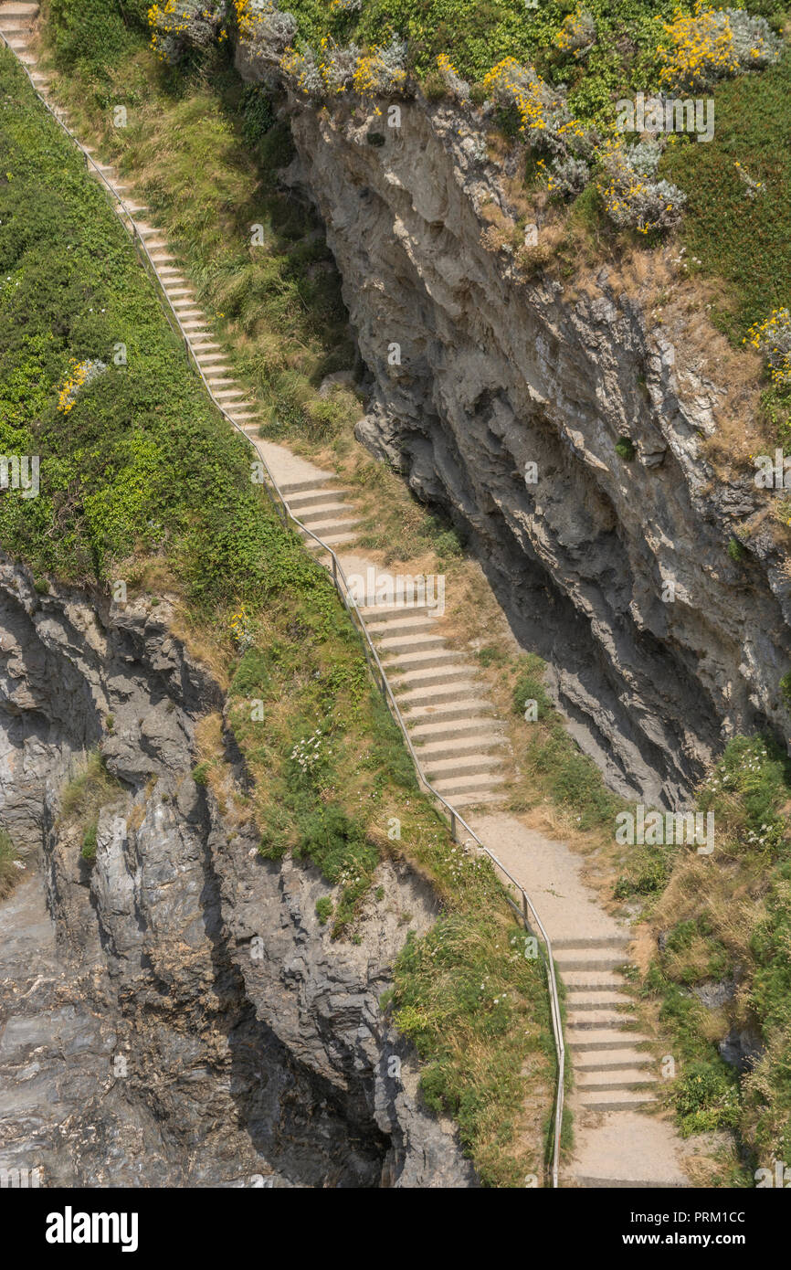 Steep steps leading to/from beach at Newquay, Cornwal .For climbing career ladder, corporate ladder. Also housing ladder / property ladder, long climb Stock Photo