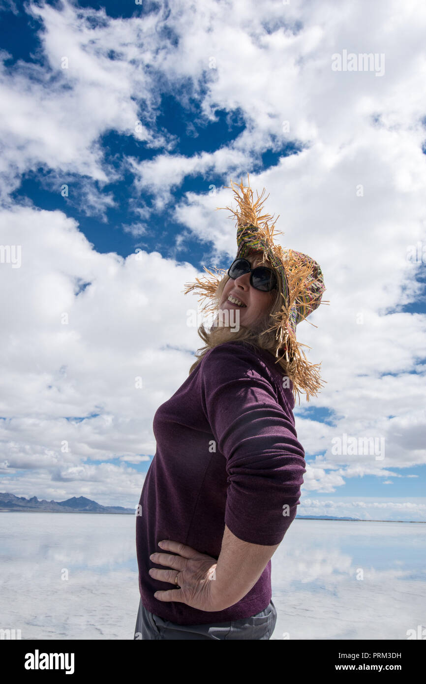 Senior woman middle age (60s) wears a straw hat at the Bonneville Salt