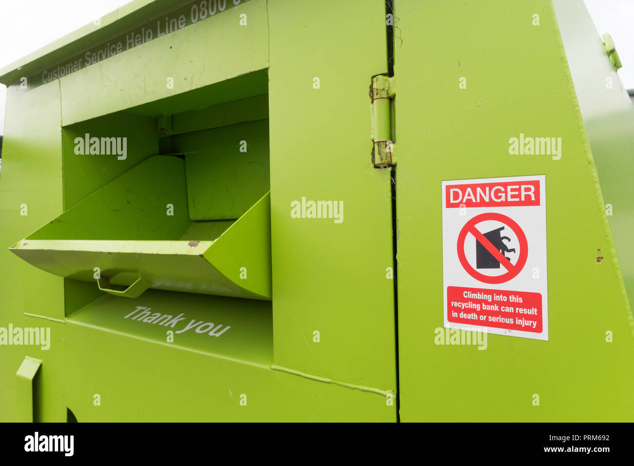 Sign, Danger, climbing into this recycling bank can result in death
