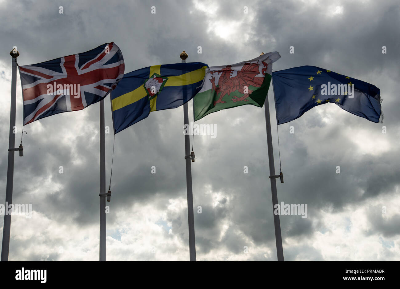 Flags at Fishguard seafront: EU, Wales,Pembrokeshire and Great Britain Stock Photo