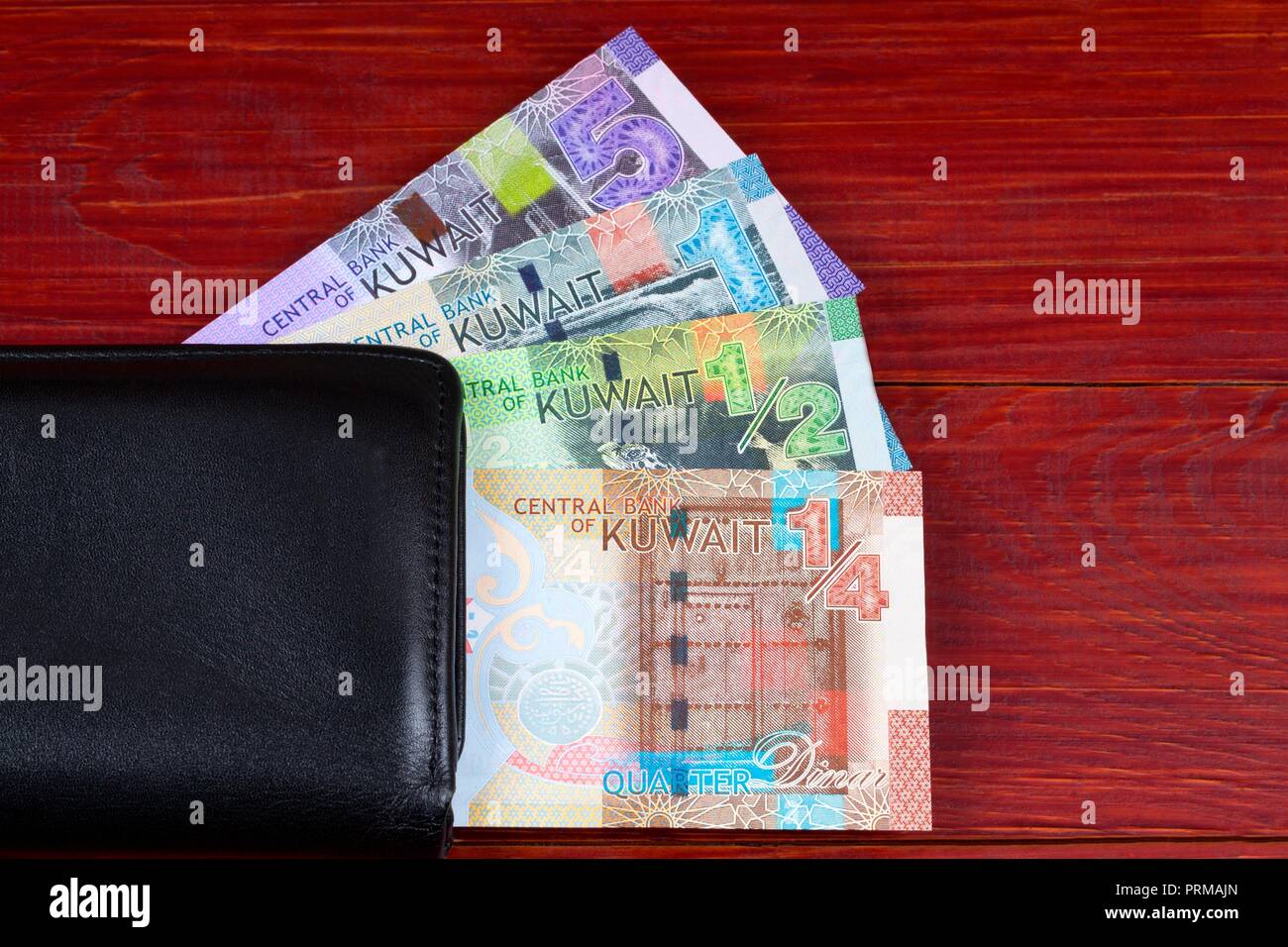 Money from Kuwait in the black wallet Stock Photo Alamy