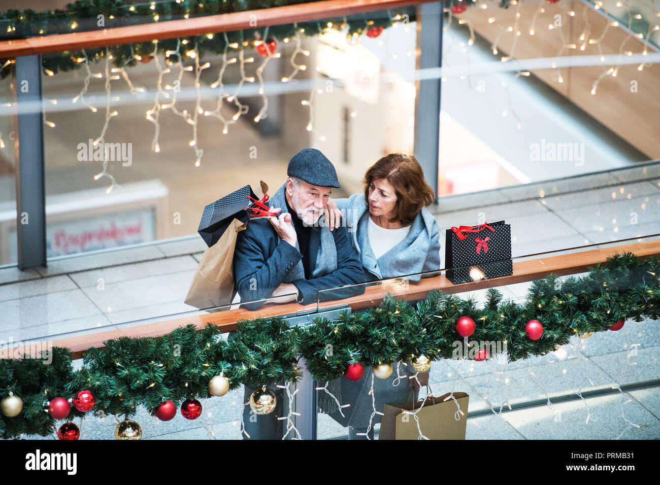 Senior man with shopping bags hi-res stock photography and images - Alamy