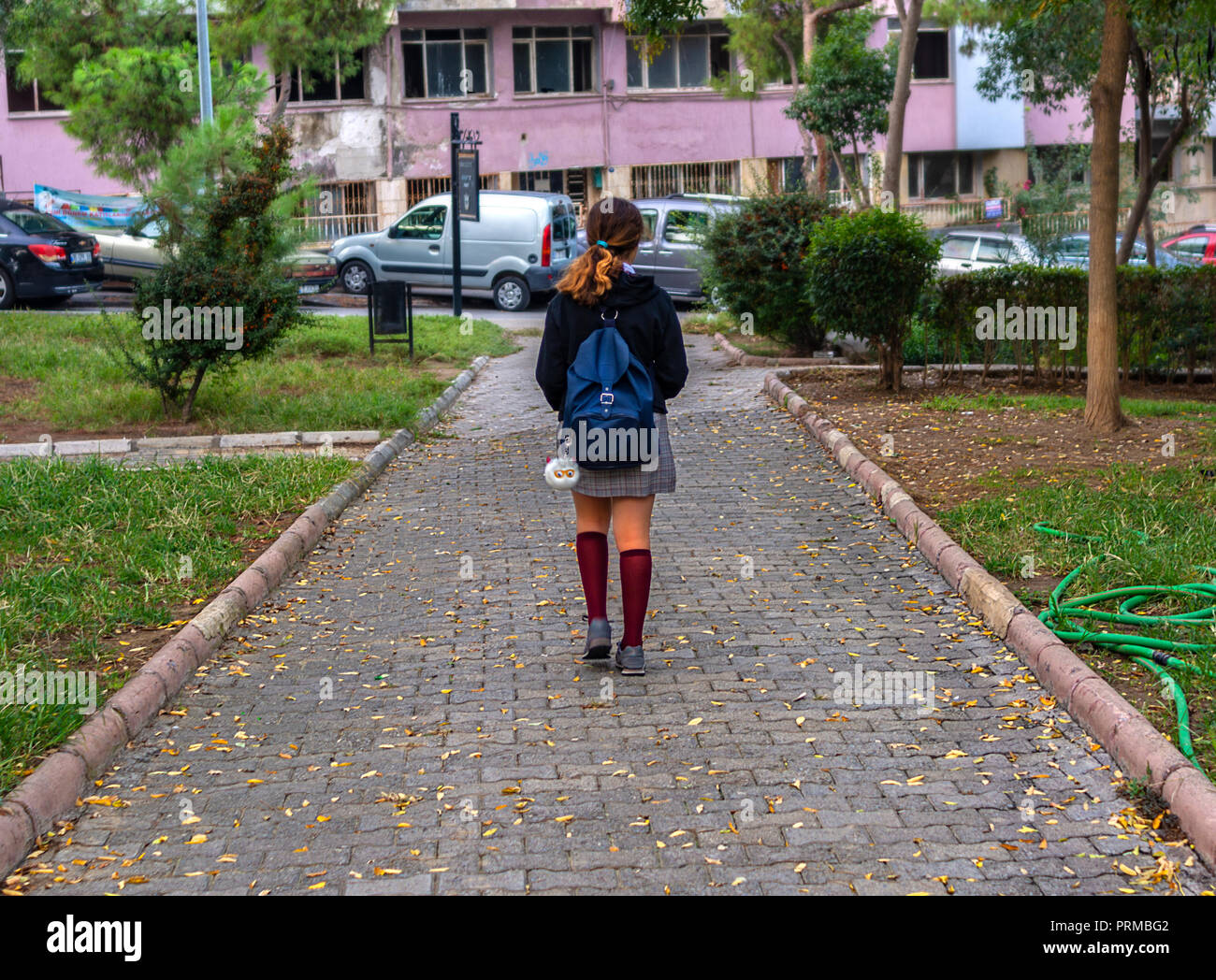 Girl walking to school alone hires stock photography and images Alamy
