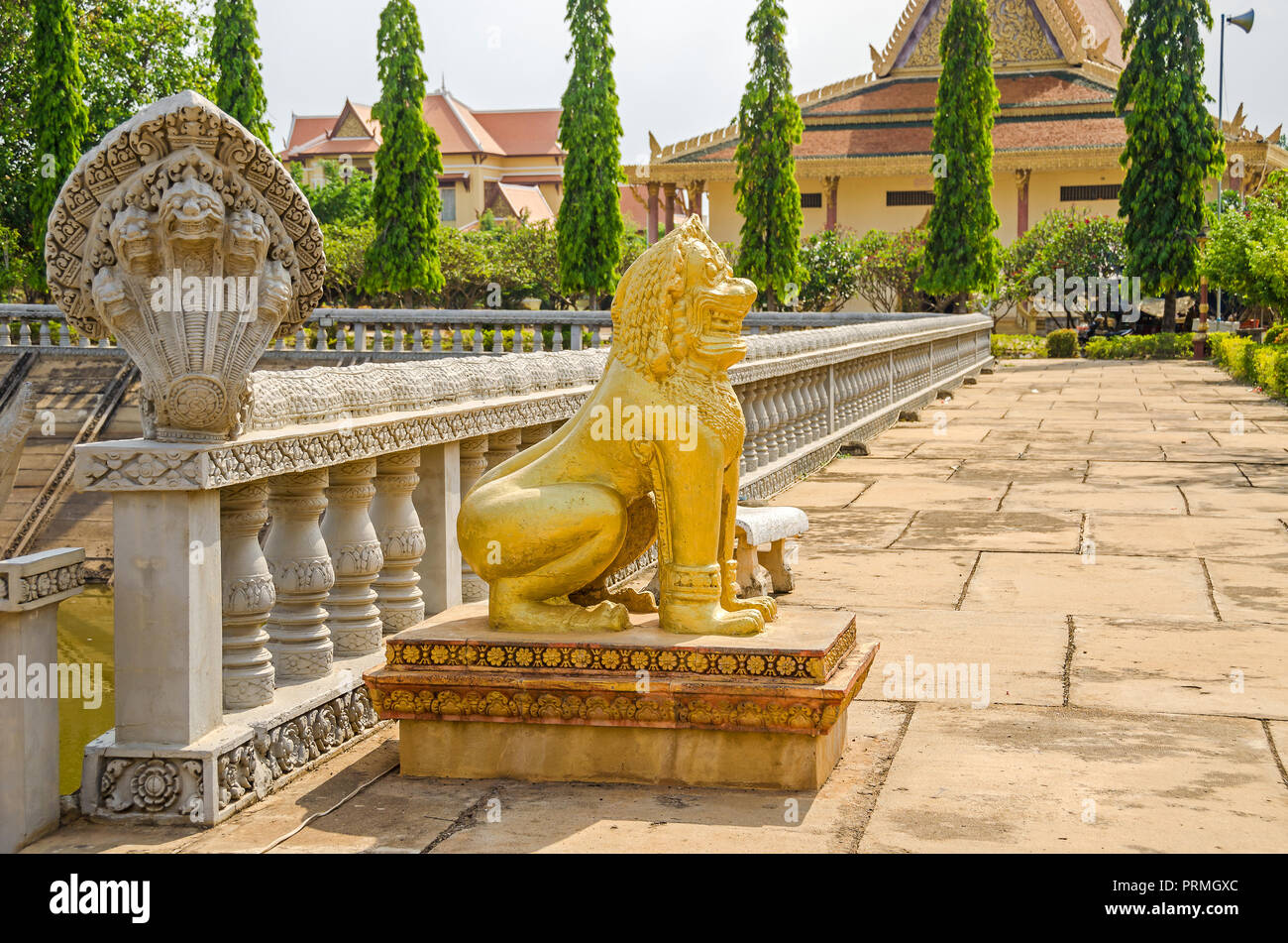 Cambodian fiveheaded naga and a lion, depicted as guardian statues at