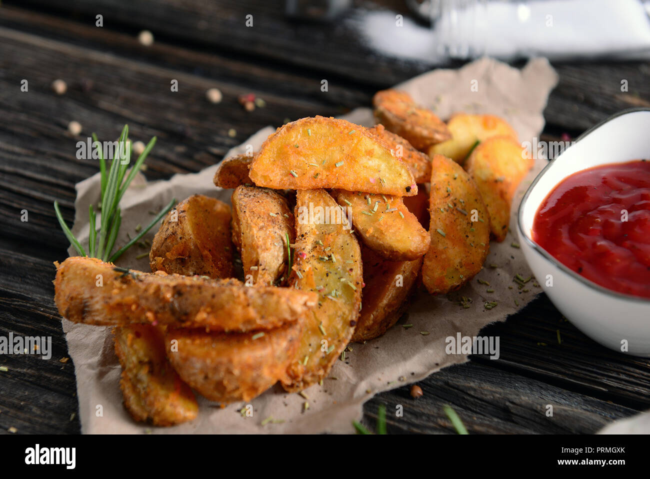 Potato wedges with herbs Stock Photo Alamy