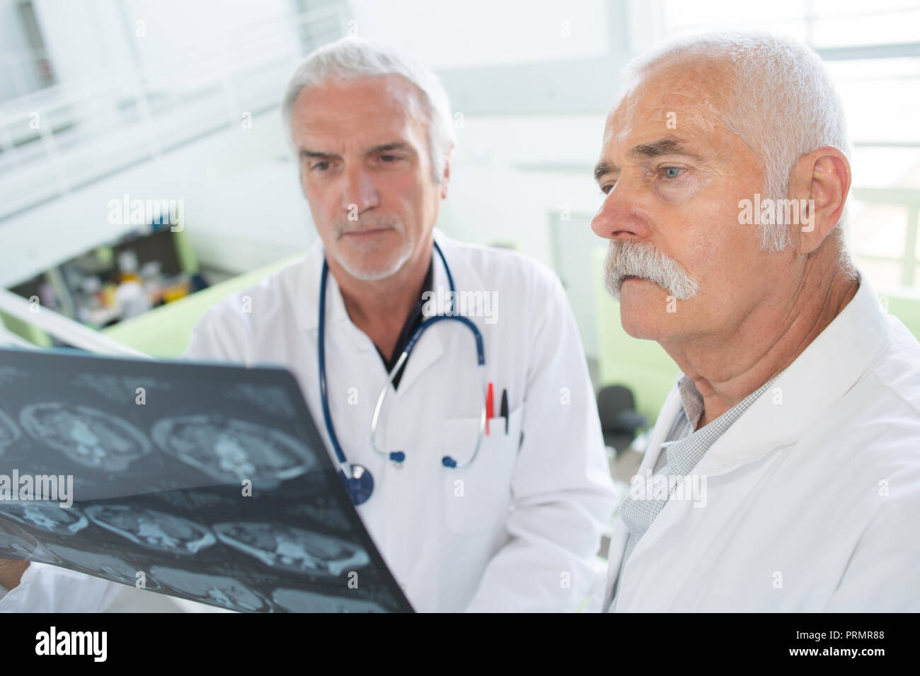 doctors studying a radiology result Stock Photo Alamy