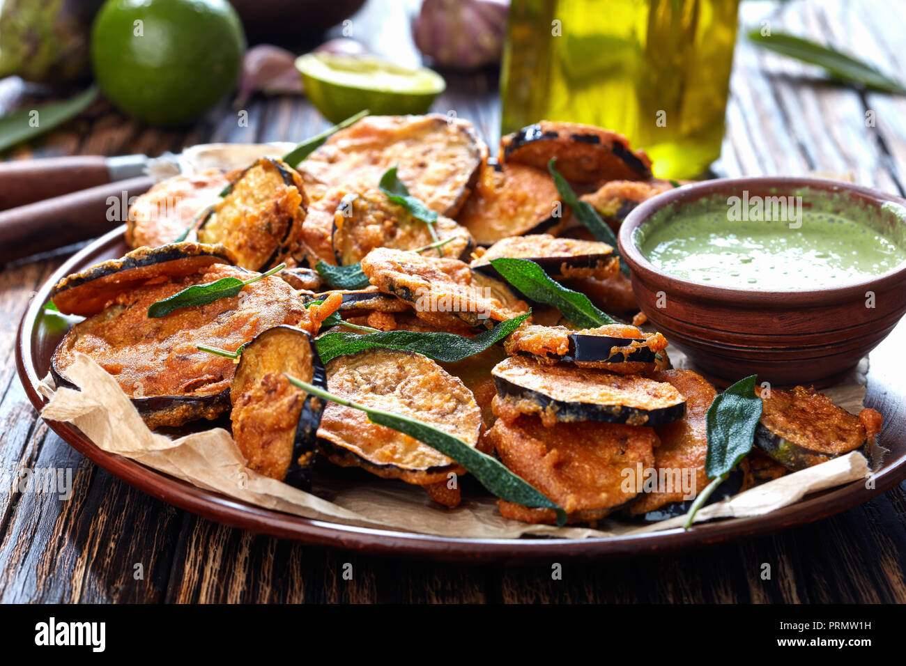 breaded Fried Eggplant Aubergine slices on a earthenware plate with