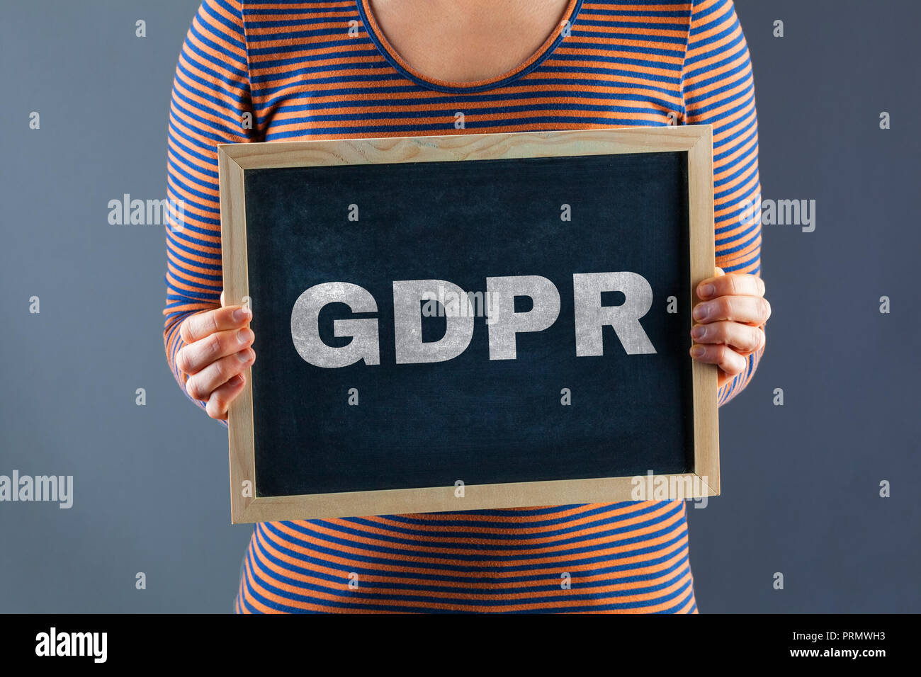 Female hands holding small chalkboard with GDPR text Stock Photo