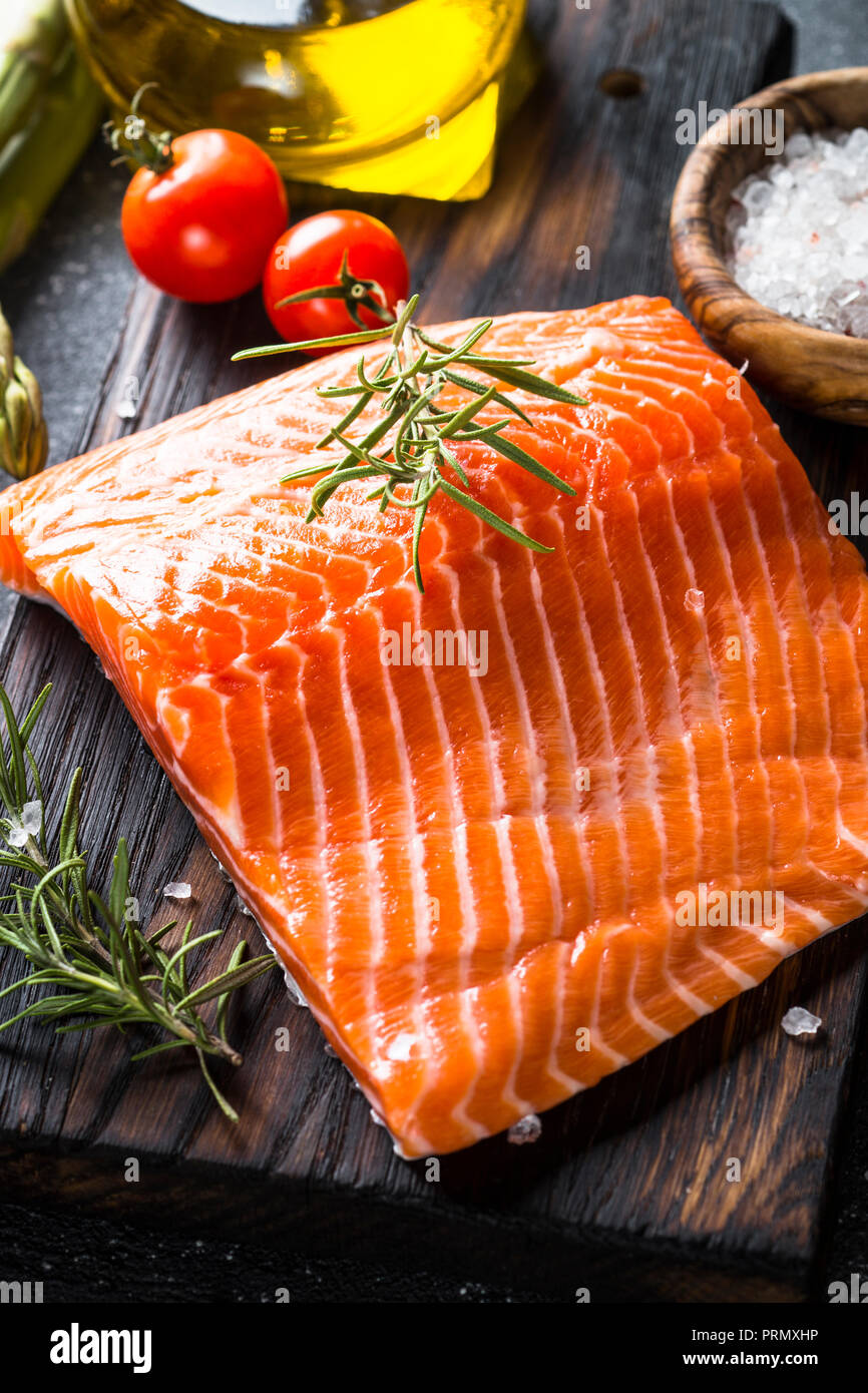 Salmon fillet with ingredients for cooking - fresh vegetables a Stock
