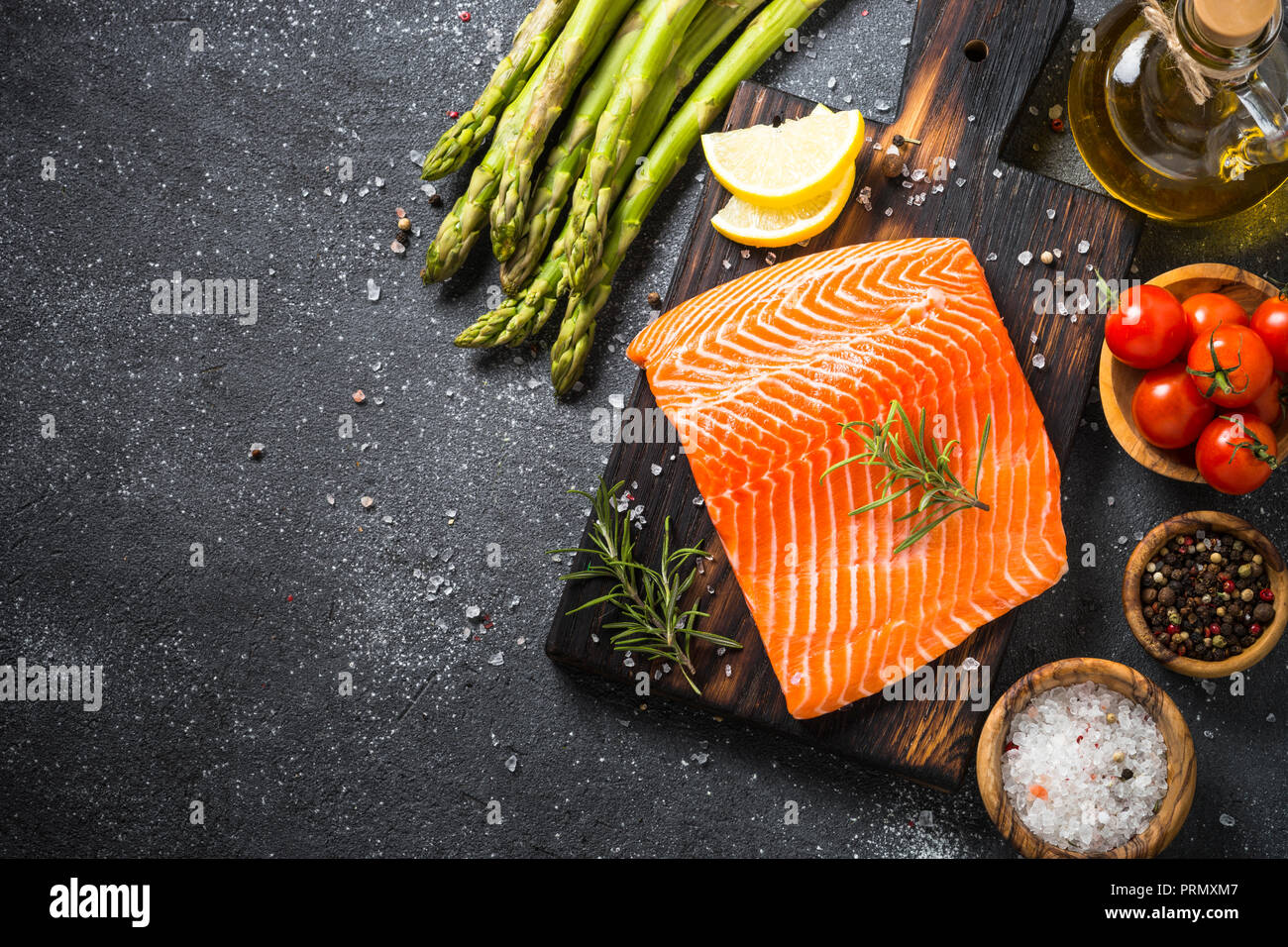 Salmon fillet with ingredients for cooking - fresh vegetables a Stock