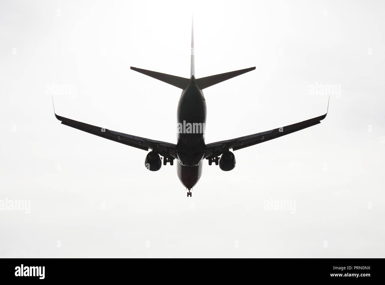 silhouette of aircraft flying in the sky Stock Photo - Alamy