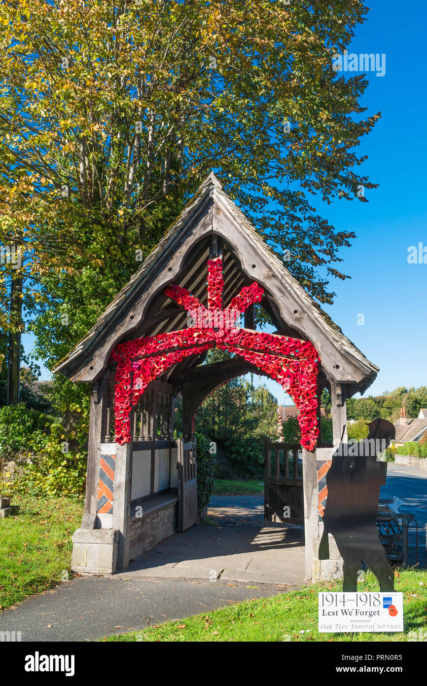 Hand stitched poppies adorn the porch of St Mary Magdalene church Eardisley to commemorate 100 years since the First World War. Herefordshire UK. Sept Stock Photo