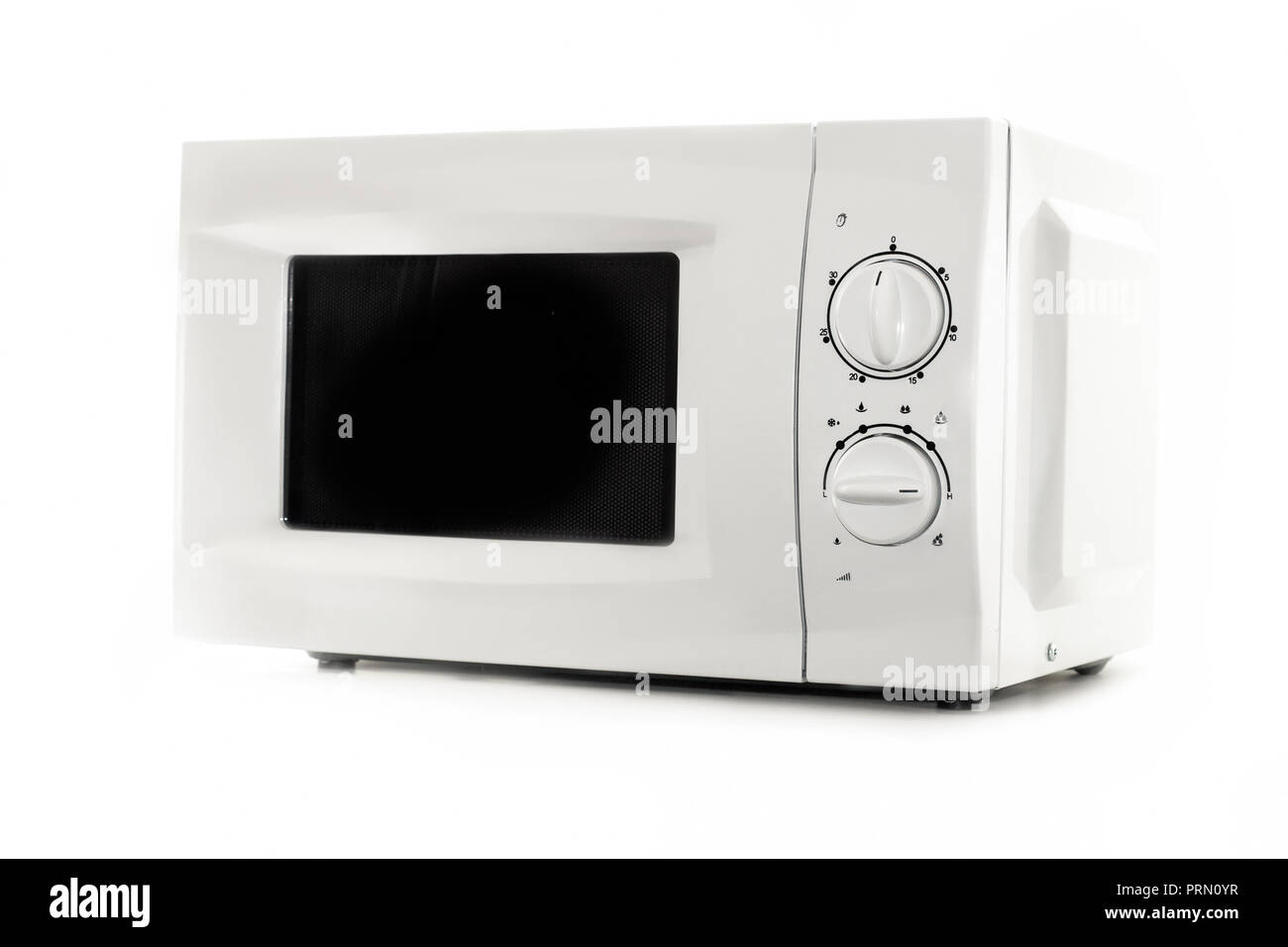 Microwave oven circular timer for one hour, analogue white. Stock Photo