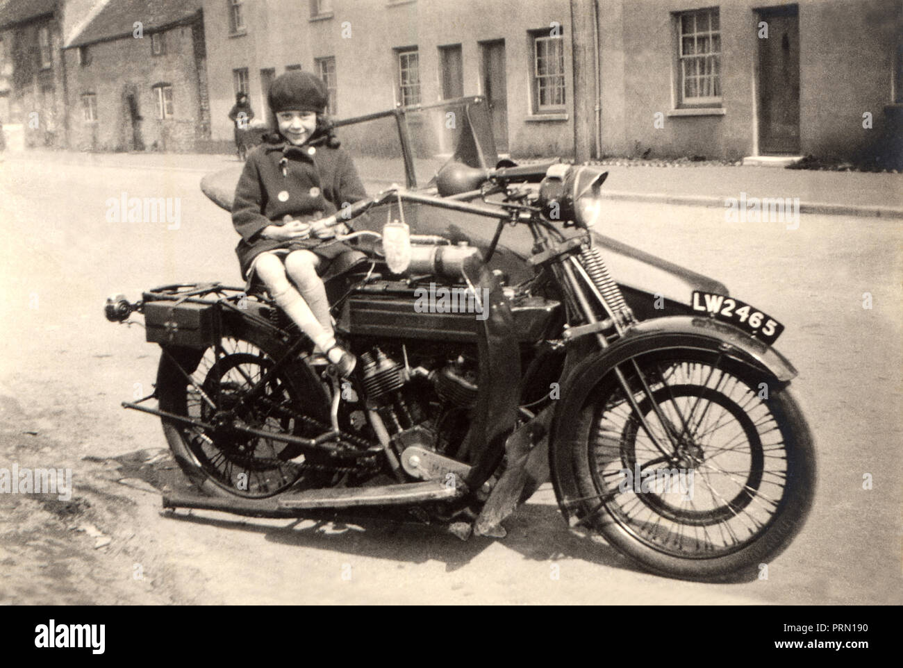 Young girl sat on a 1921/22 Royal Enfield 1000cc motorcycle & sidecar combination early 1920s Stock Photo