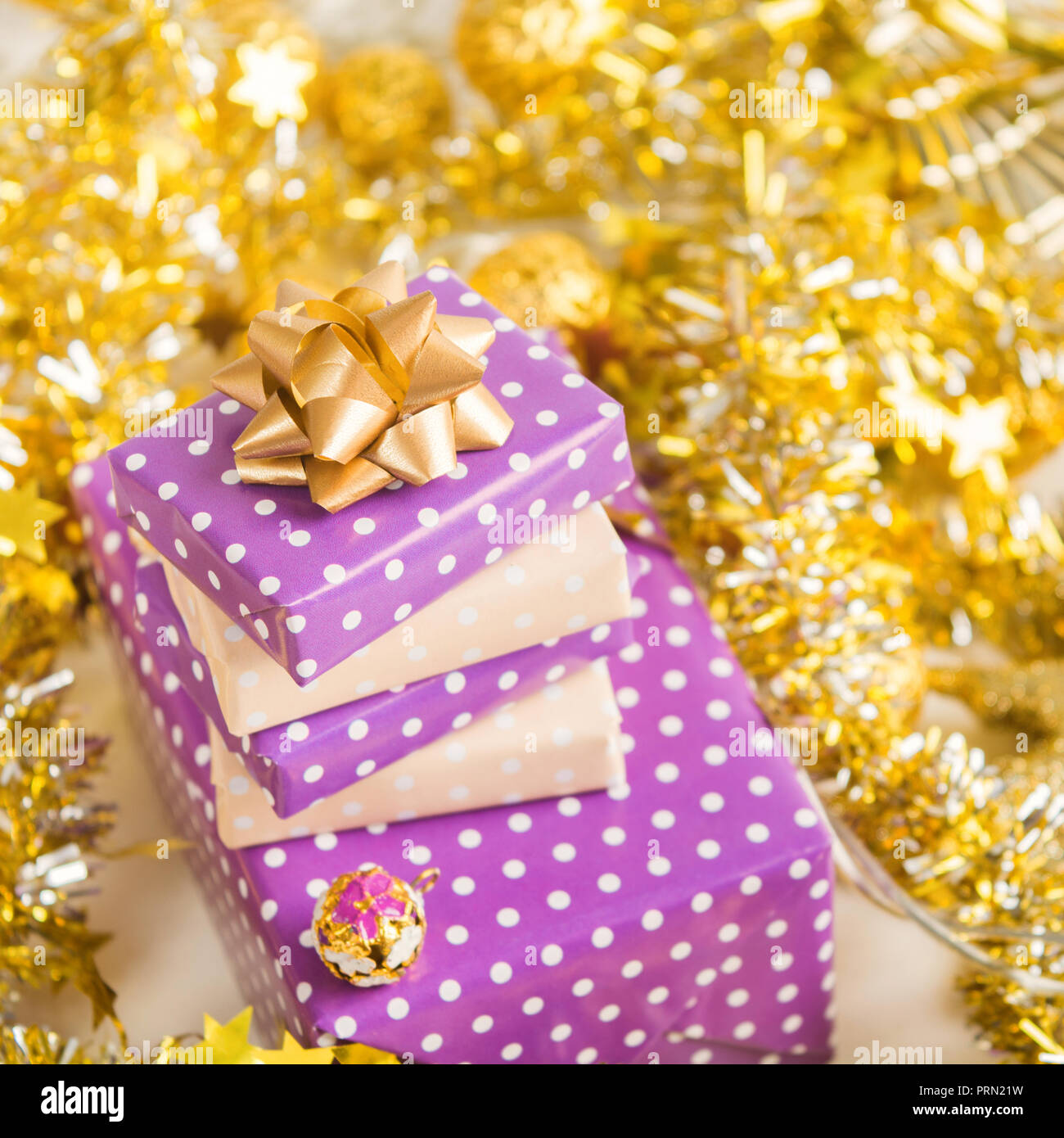 Elegant Beige And Violet Purple Gift Boxes Stack With Ribbon