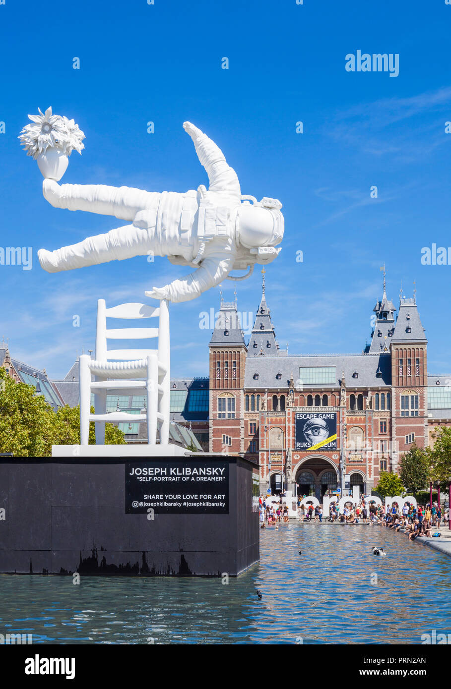 Amsterdam Rijksmuseum Amsterdam “Self Portrait of a Dreamer” sculpture by Joseph Kliibansky in the pool on Museum Square Amsterdam Holland Netherlands Stock Photo