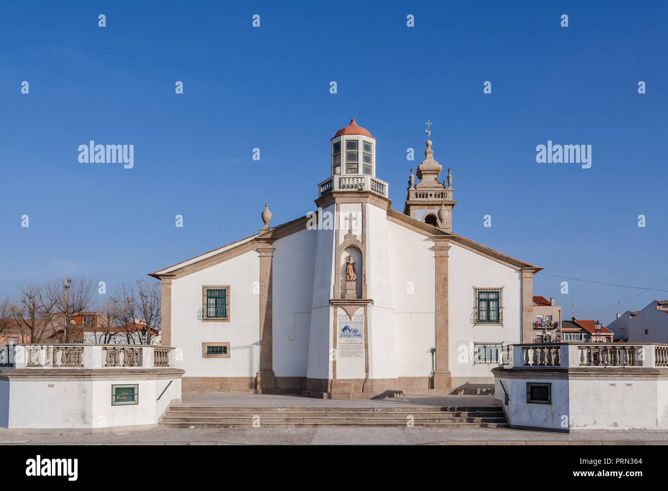 Nossa Senhora da Lapa church with a lighthouse imbedded in Povoa de Varzim, Portugal. Where local fishermen and families seek help in times of danger Stock Photo