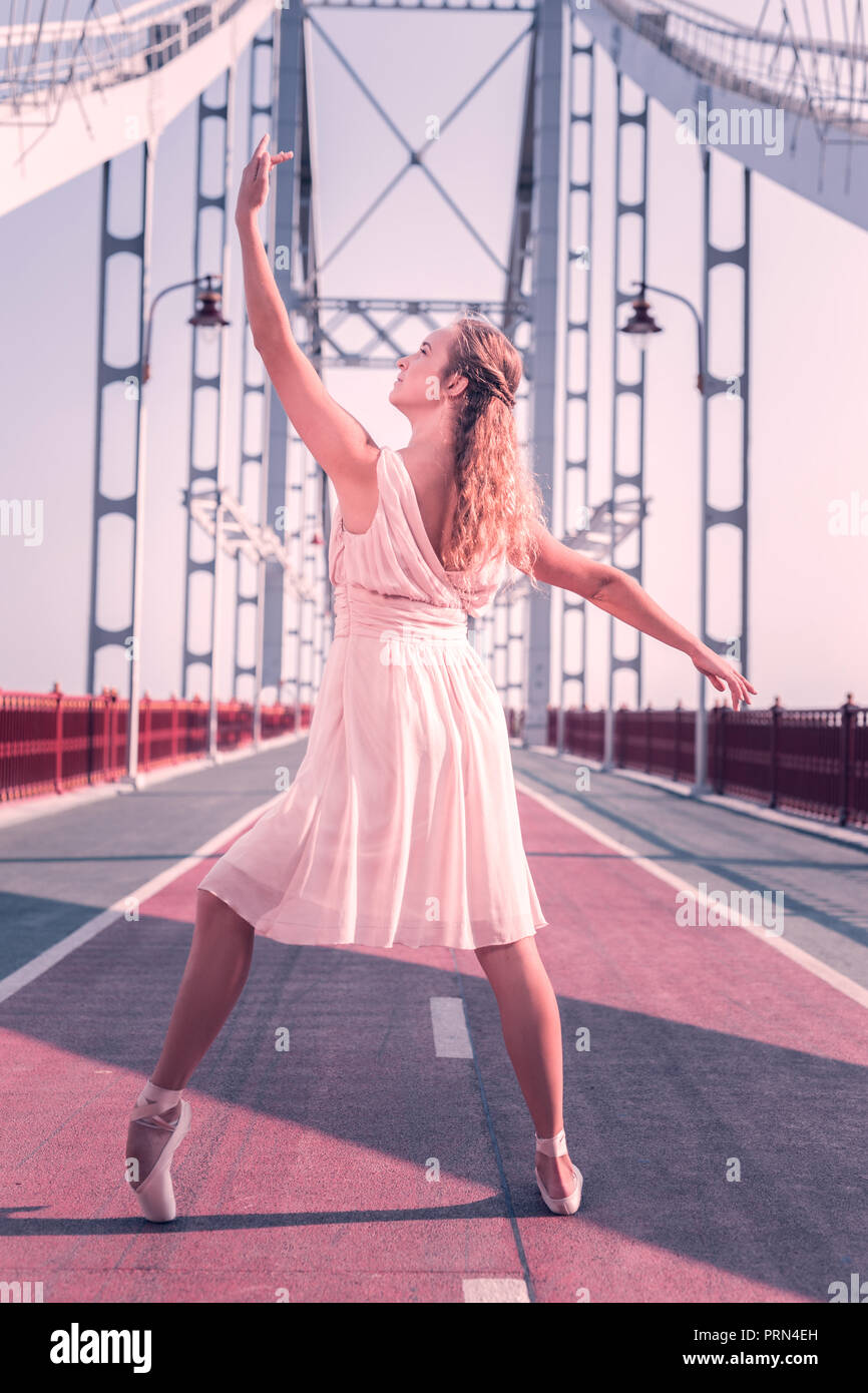 Nice beautiful young woman holding her hand up Stock Photo