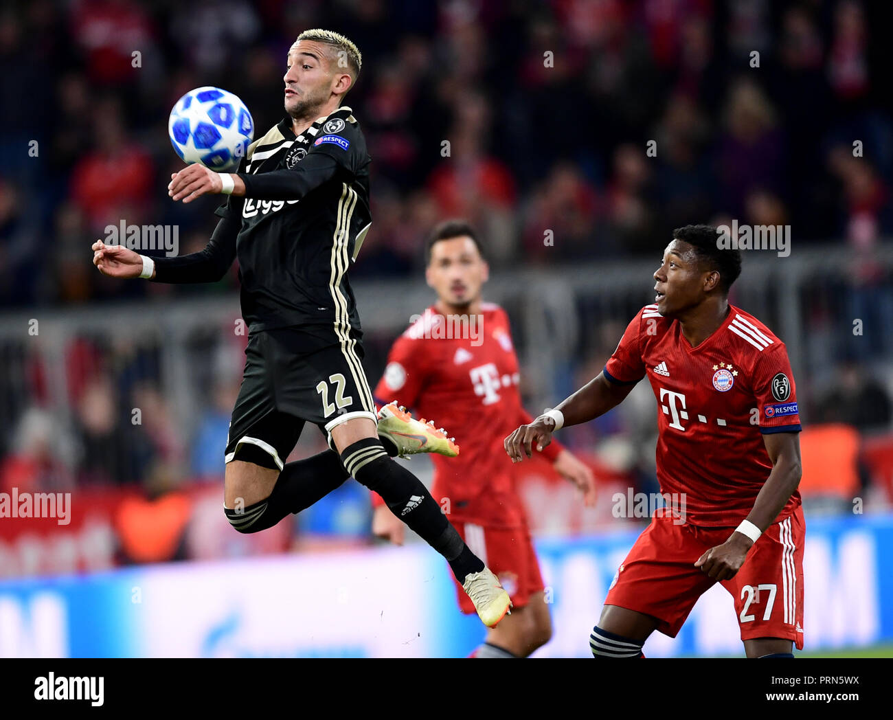 Munich, Bavaria. 01st Oct, 2018. Soccer: Champions League, Bayern Munich -  Ajax Amsterdam, Group stage, Group E, 2nd matchday in the Allianz Arena.  David Alaba (r) from Munich and Hakim Ziyech from