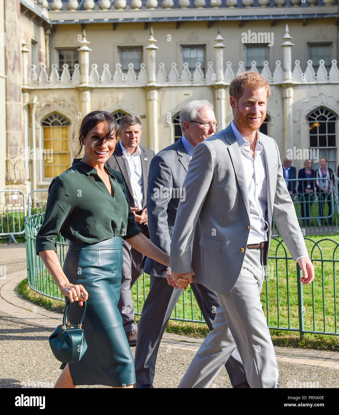 Brighton UK 3rd October 2018 - The breeze blows the Duchess of Sussex's fringe across her face as she holds  hands with the Duke of Sussex after visiting the Royal Pavilion in Brighton today as part of their first visit to the county where they have been to Chichester and Bognor as well as Brighton . Since then it has been announced the Duchess is expecting . Credit: Simon Dack/Alamy Live News Stock Photo