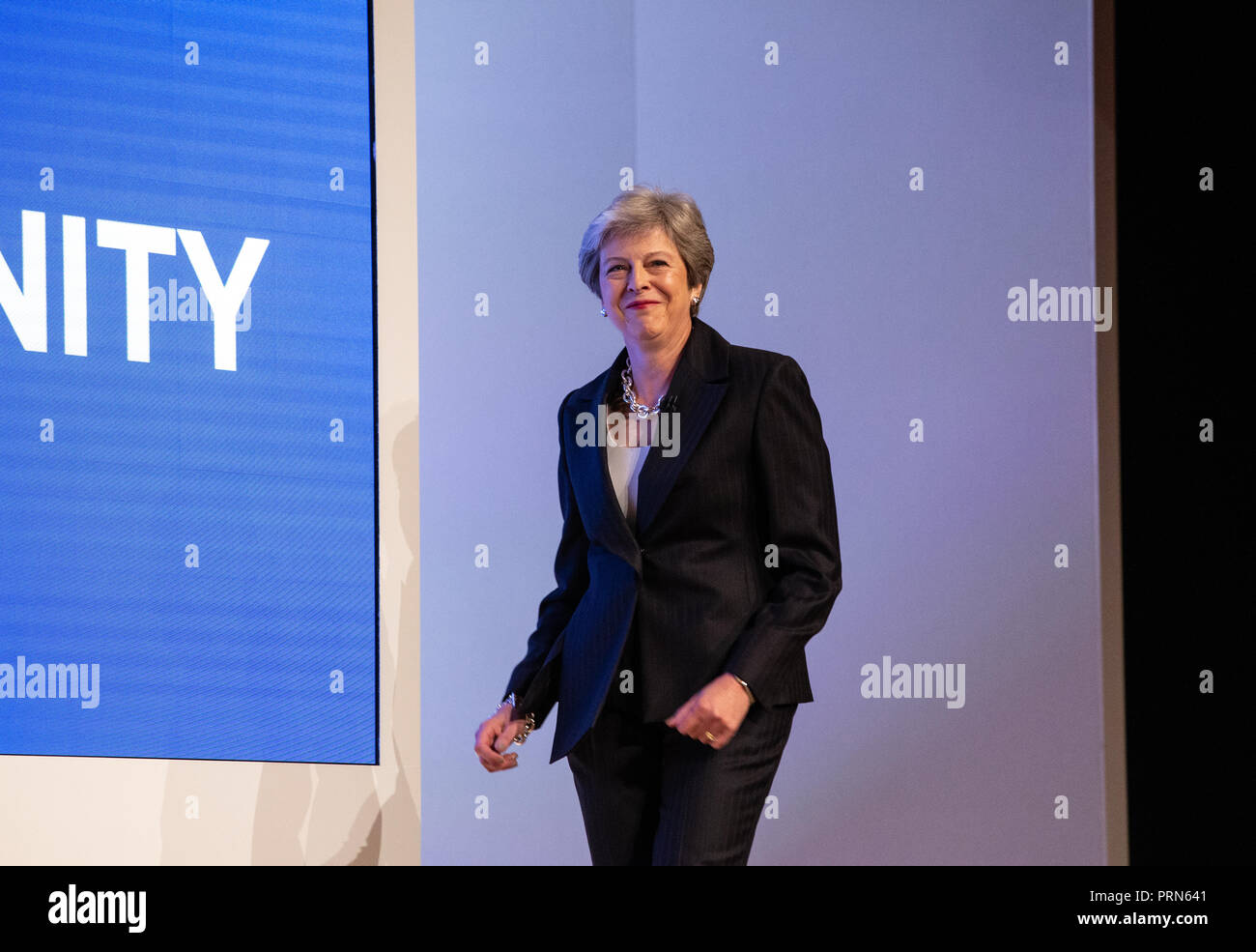 Birmingham, UK. 3rd Oct 2018. Theresa May walks on stage to the tune of 'Dancing Queen' by Abba and starts dancing before she delivers her Leaders' speech to the Conservative Party Conference in Birmingham. Credit: Mark Thomas/Alamy Live News Stock Photo