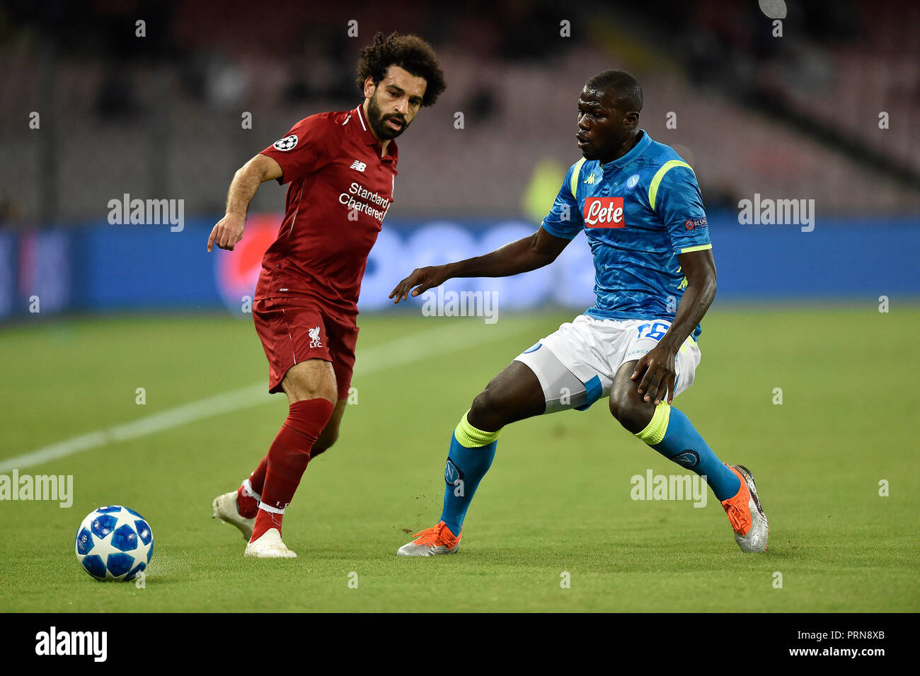 Naples, Italy. 3rd Oct 2018. Mohamed Salah of Liverpool is challenged by  Kalidou Koulibaly of Napoli during the UEFA Champions League group C match  between SSC Napoli and Liverpool FC at Stadio