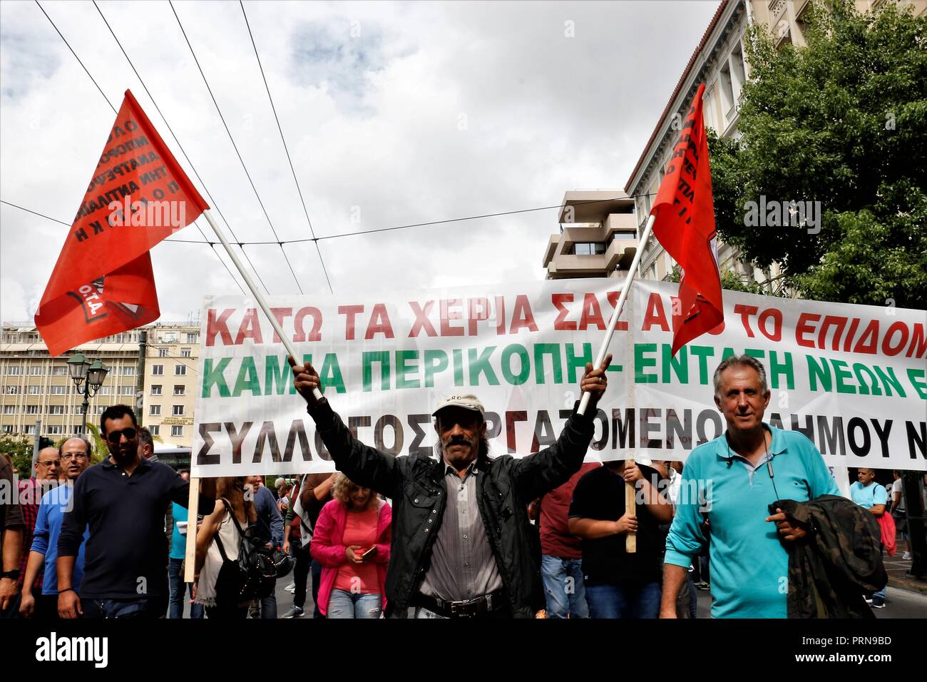 Athens, Greece. 3rd Oct, 2018. Protesters are seen walking holding a banner and flags during the protest.Greek Unions protest demanding better benefits for hazardous occupations. Credit: Helen Paroglou/SOPA Images/ZUMA Wire/Alamy Live News Stock Photo