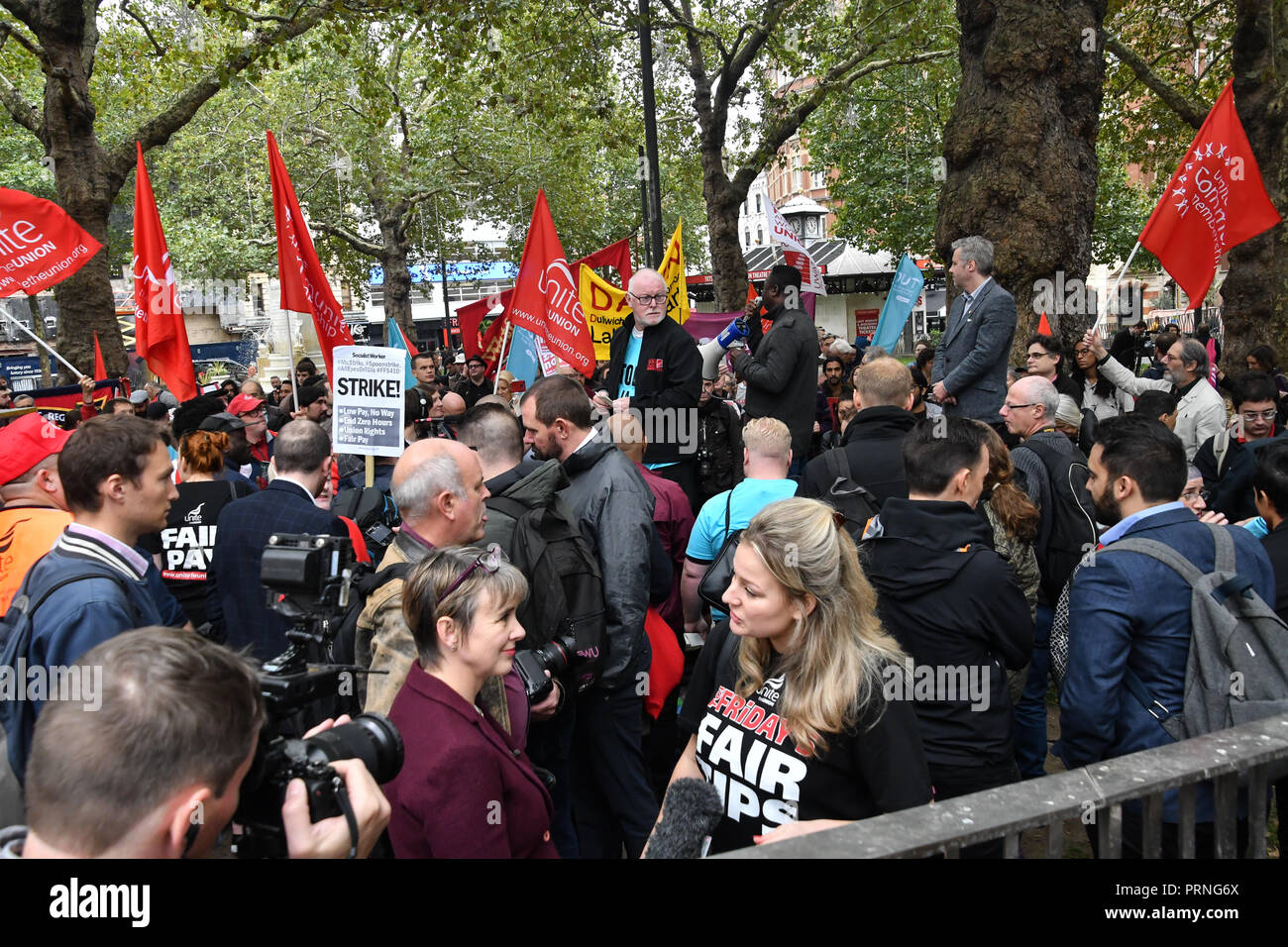 London, UK. 4th Oct 2018. Hundreds workers united from American, Brazil Thailand and UK Rally for McDonald's, TGI Fridays & Wetherspoons Strikers. Protestors demand £10 an hour at Leicester Square, London, UK. 4th October 2018. Credit: Picture Capital/Alamy Live News Stock Photo
