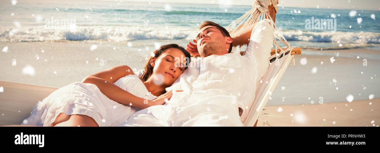 Composite image of calm couple napping in a hammock Stock Photo