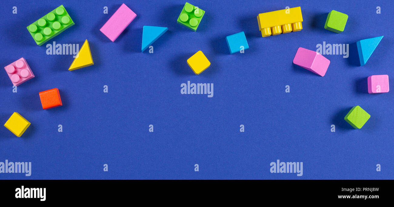 Baby kid toys background. Colorful plastic construction blocks and ...