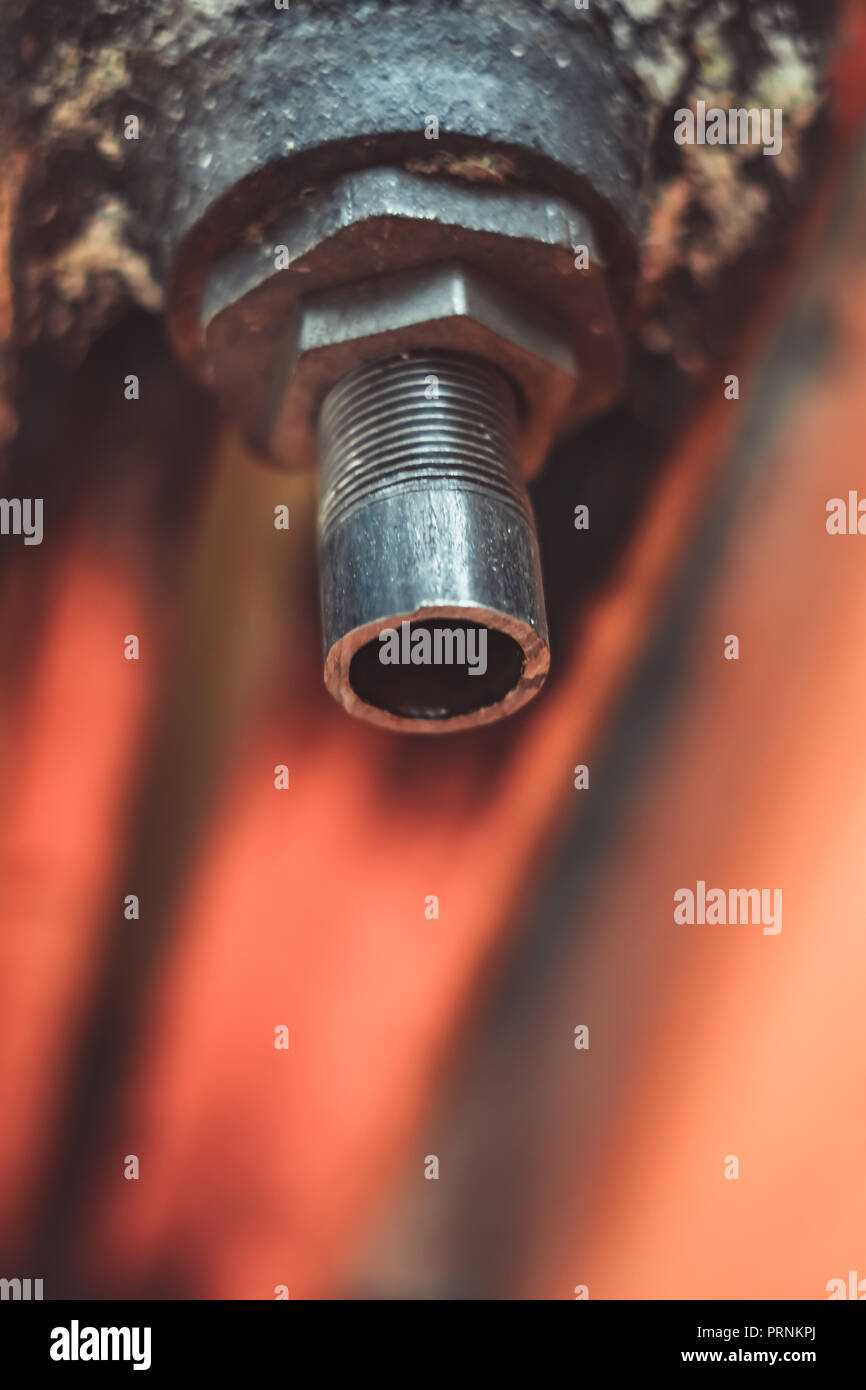 the radiator is broken, sawed off the end Stock Photo Alamy