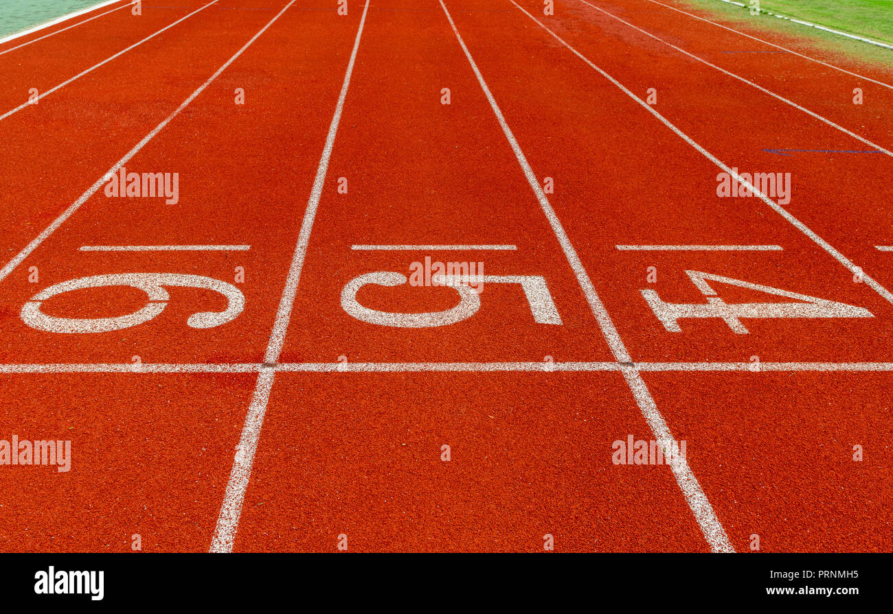Running track with Number, starting concept Stock Photo - Alamy