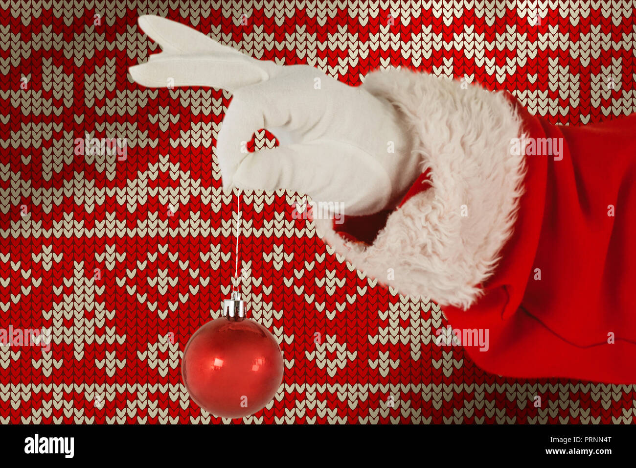 Santa Claus holding a 
signage ornament