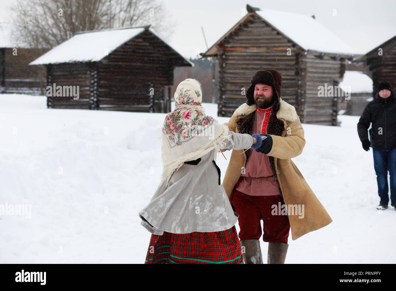Couple in traditional winter costume of peasant in russia Stock Photo