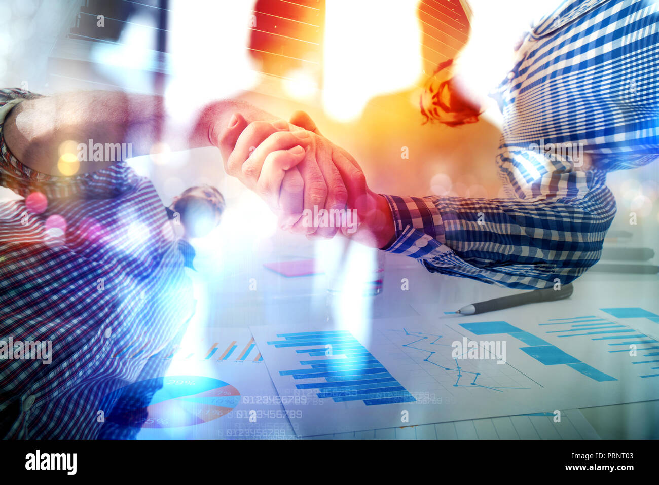 Handshaking business person in casual wear in the office. concept of teamwork and partnership. double exposure Stock Photo