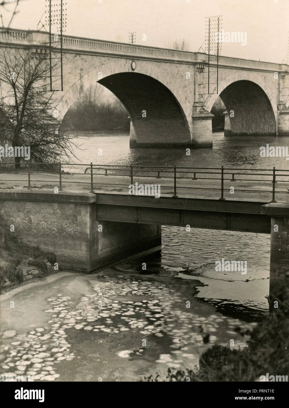 The river Vaucouleurs meeting the river Seine, Mantes, France 1938 Stock Photo