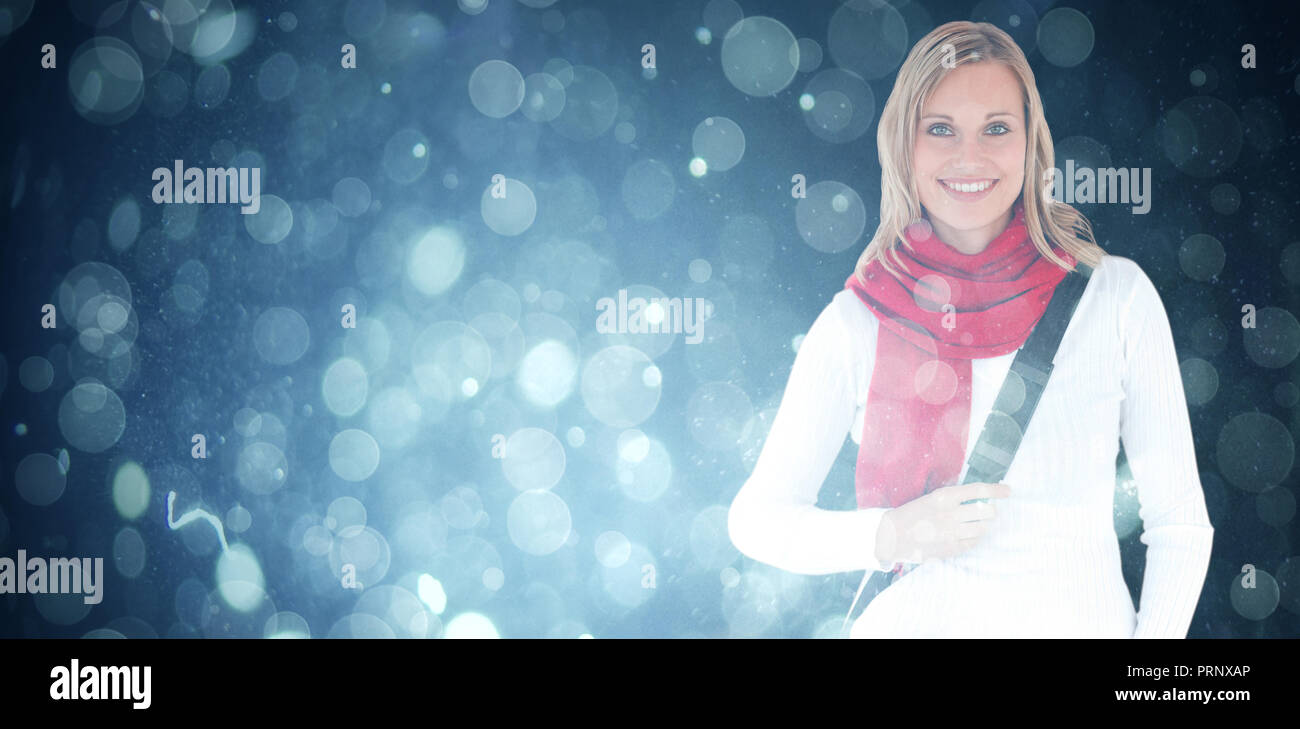 Composite image of portrait of a delighted student with scarf smiling at the camera Stock Photo