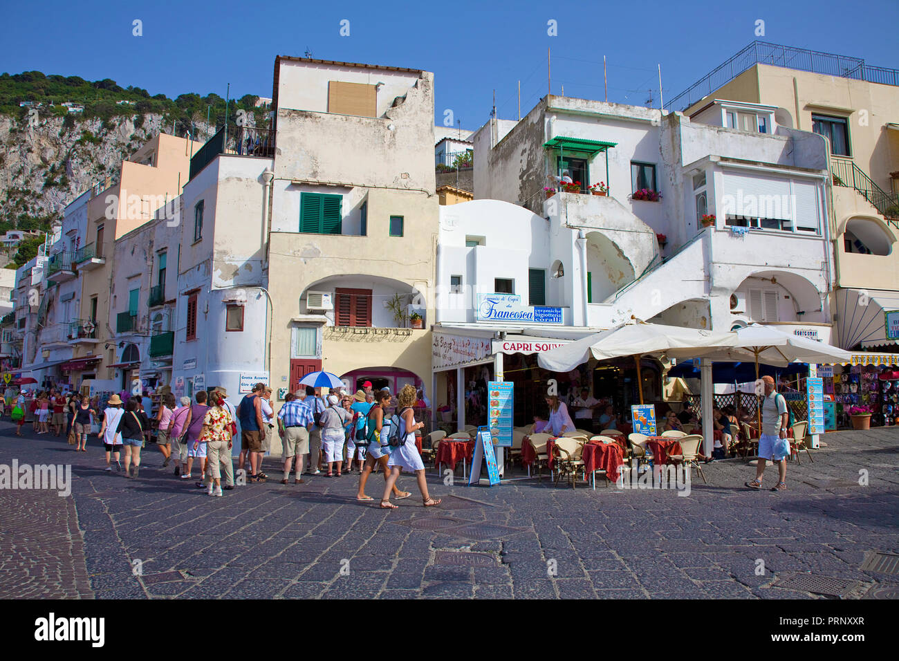 Street cafes at the promenade of Marina Grande, Capri island, Gulf of Naples, Campania, Italy Stock Photo