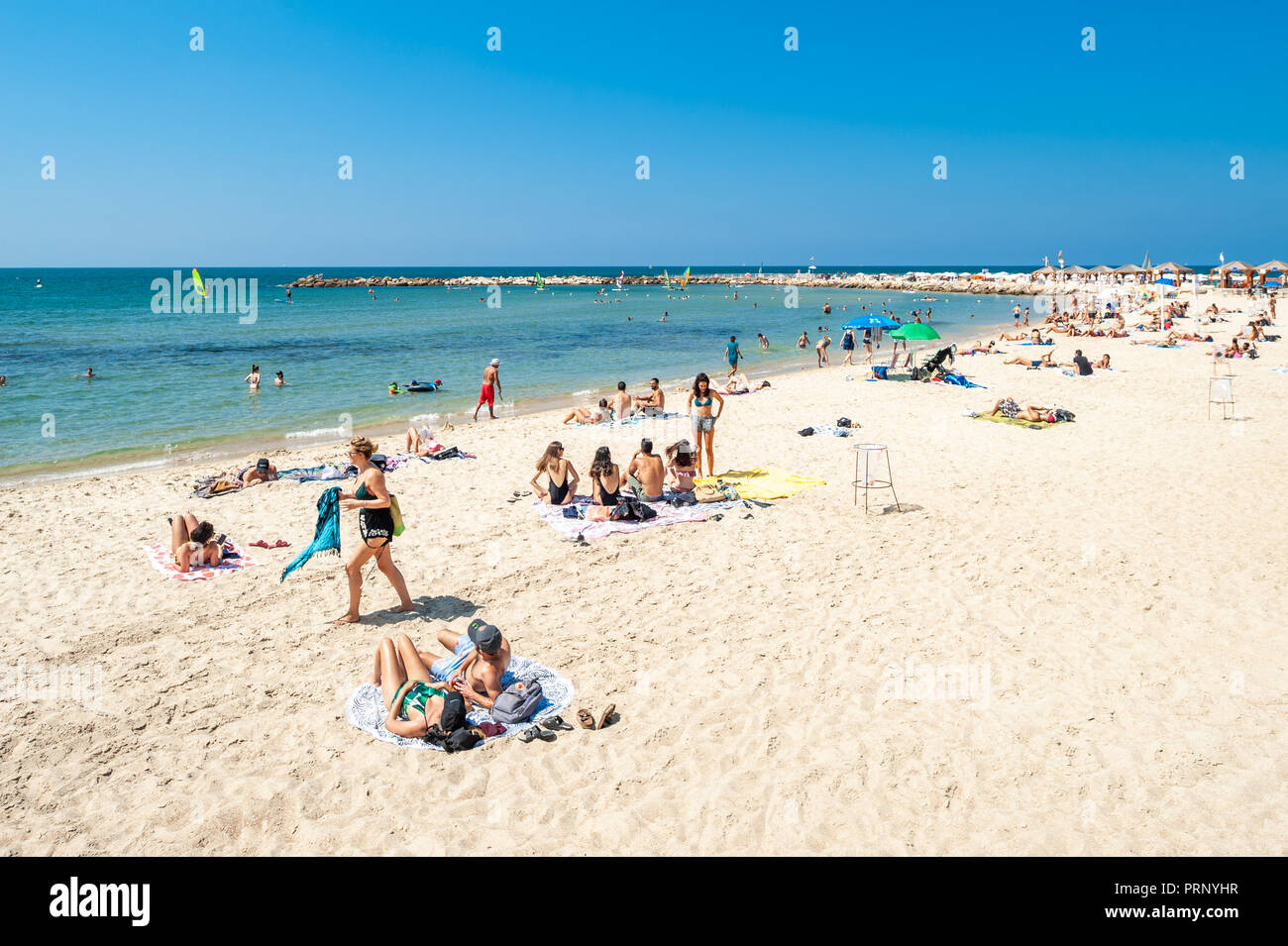 Israel, Tel Aviv - 24 September 2018: People enjoy the beach in late september Stock Photo