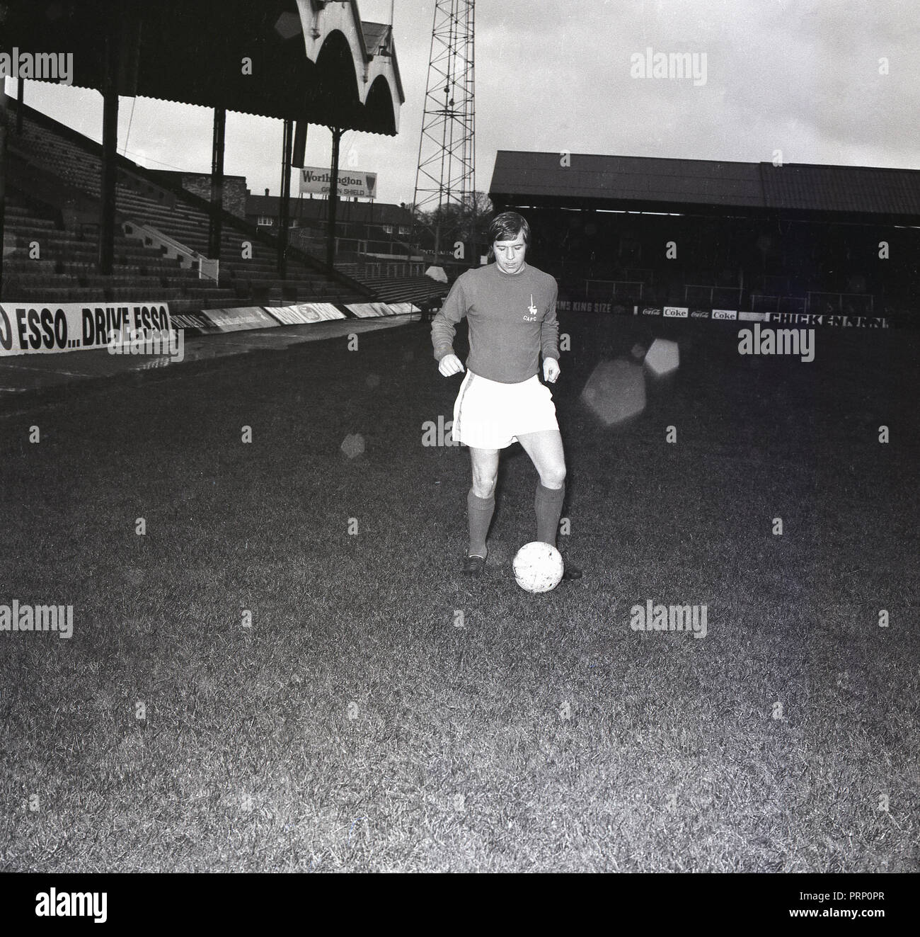 1970, October, Charlton Althetic Football Club, picture shows the club's new signing, midfield player, Walthamstow born, Dennis Bond out on the pitch in team strip with a ball. Stock Photo