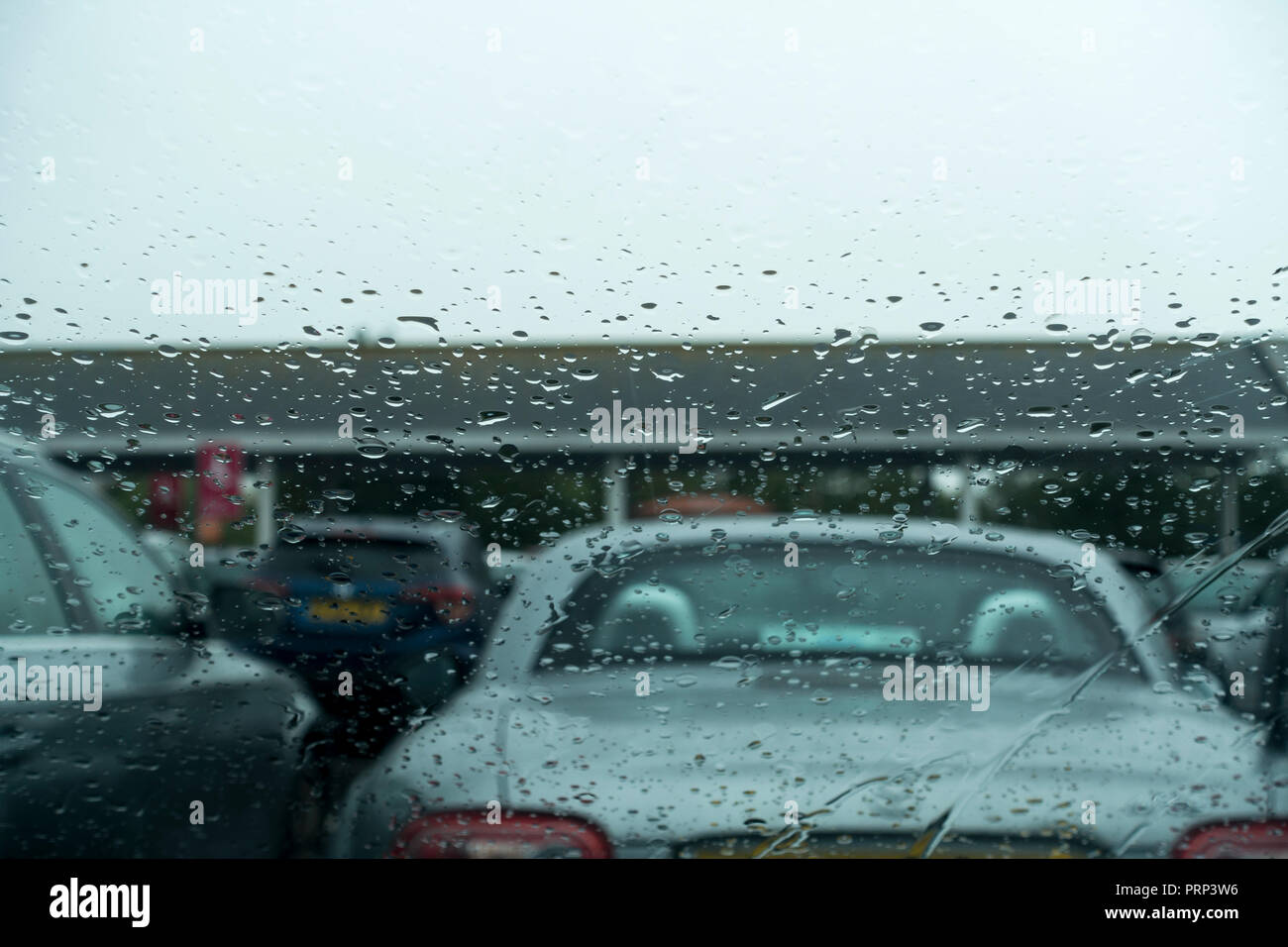 Rain on a car windscreen on a wet day in September 2018, Dorset, UK Stock Photo