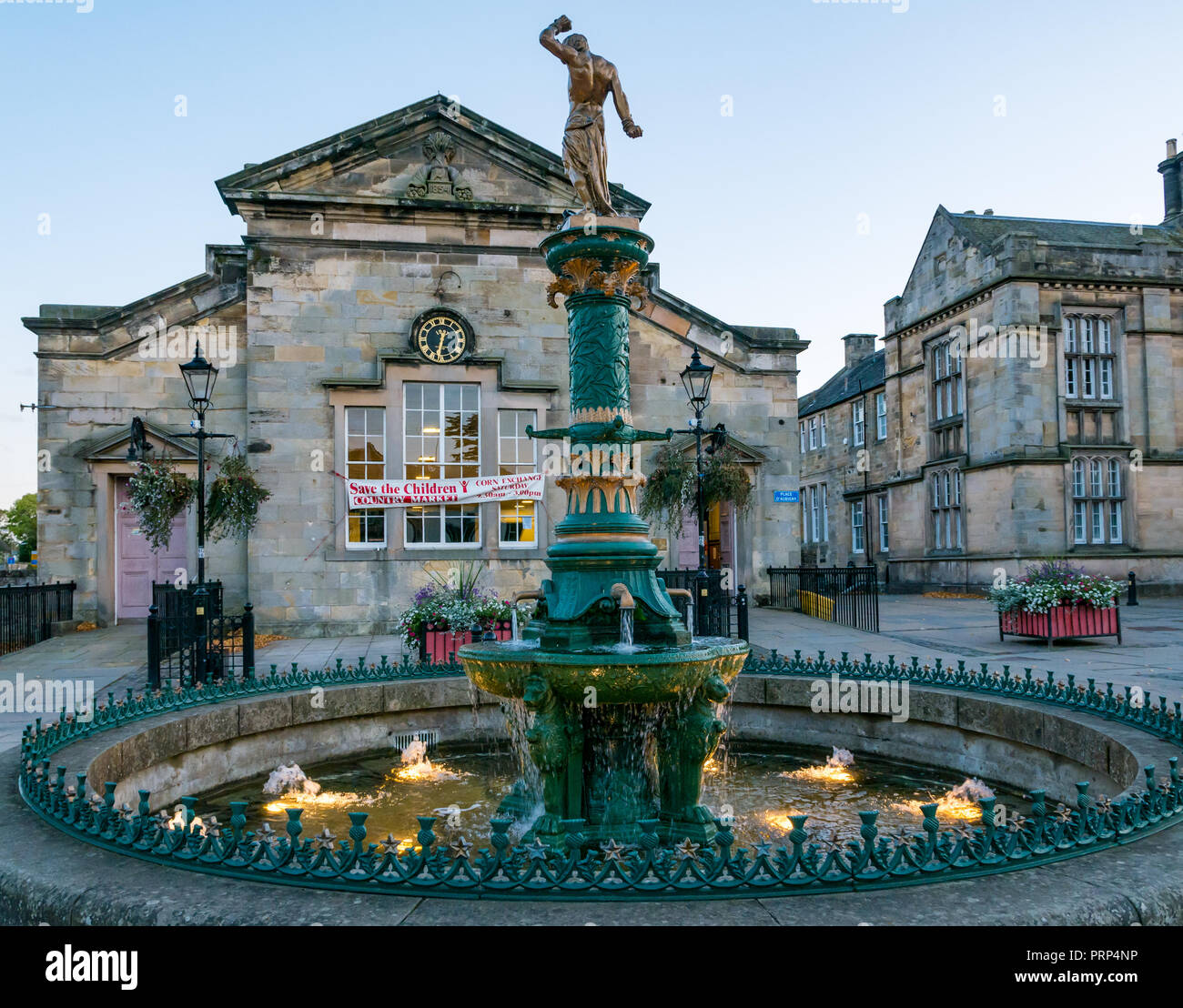 Cast iron Victorian fountain by Walter Macfarlane Saracen Foundry with Samson at top and Corn Exchange building, Haddington, East Lothian, Scotland, U Stock Photo