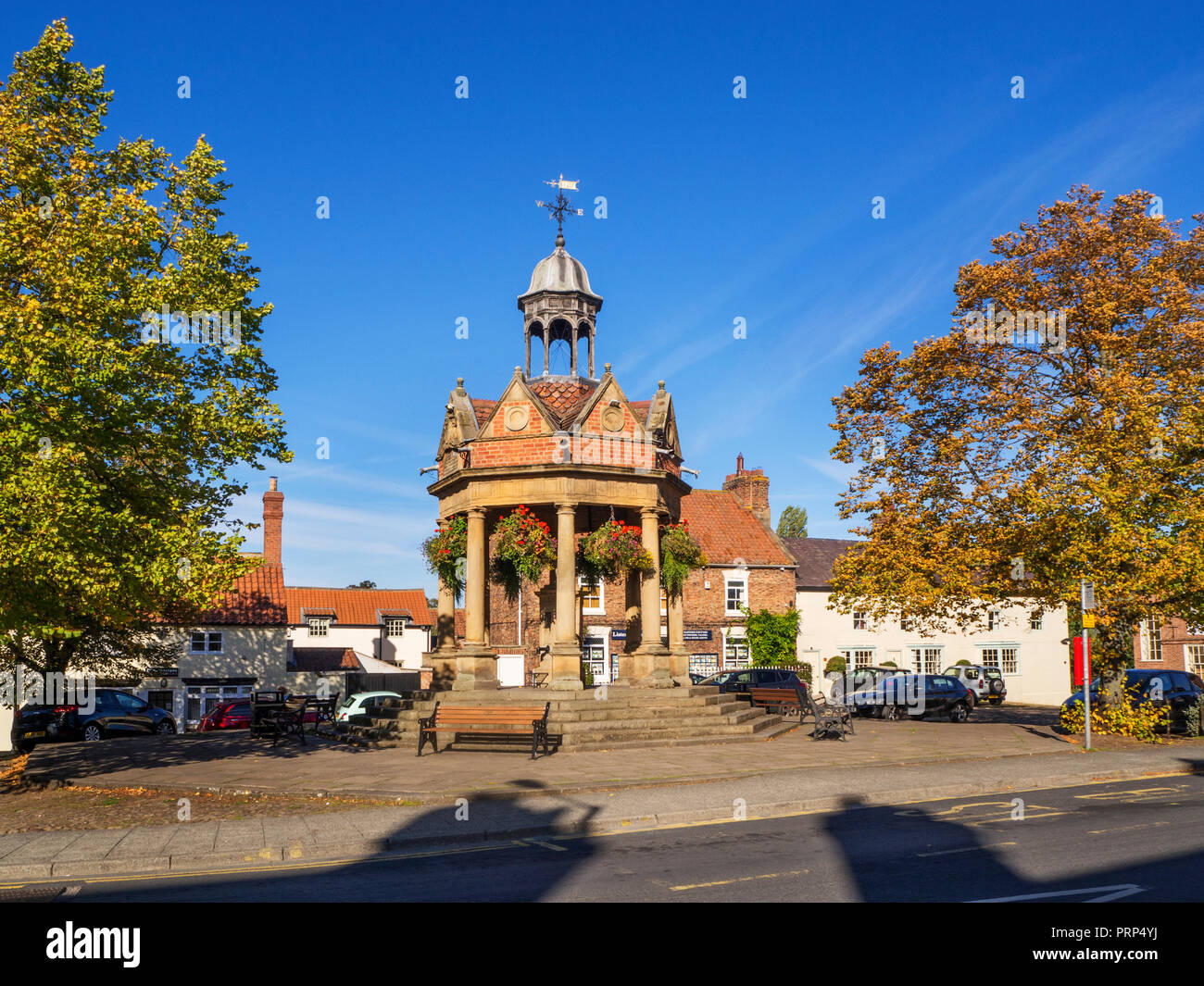 The Fountain former water pump in St James Square in early autumn at Boroughbridge North Yorkshire England Stock Photo