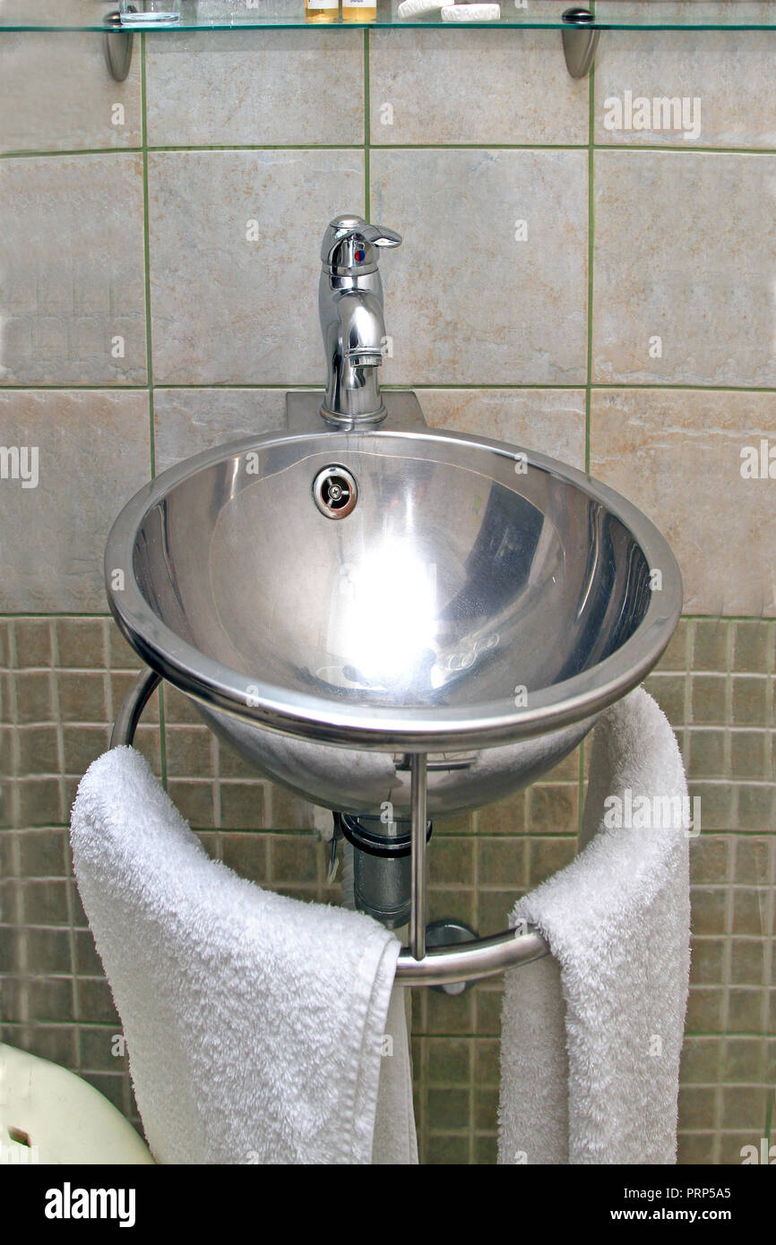 Stainless Steel Shiny Round Sink In Modern Bathroom Stock Photo