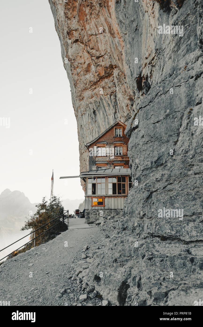 Switzerland, Ebenalp - September 27, 2018: famous mountain inn Aescher-Wildkirchli at the Ebenalp cliffs Stock Photo