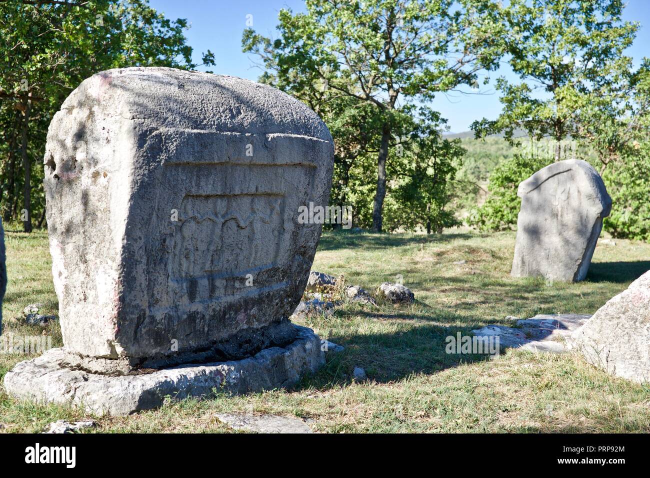 Stećci - ancient megaliths at Kamenjak necropolis near Lovreć, Dalmatia Stock Photo