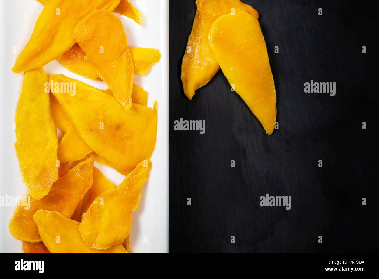 Dried Mango Fruit on Black Background Stock Photo
