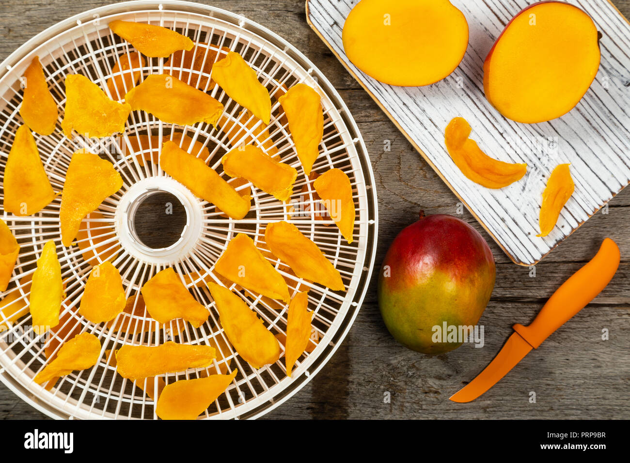 Dried Mango Fruit on a Dehydrator Rack Stock Photo Alamy