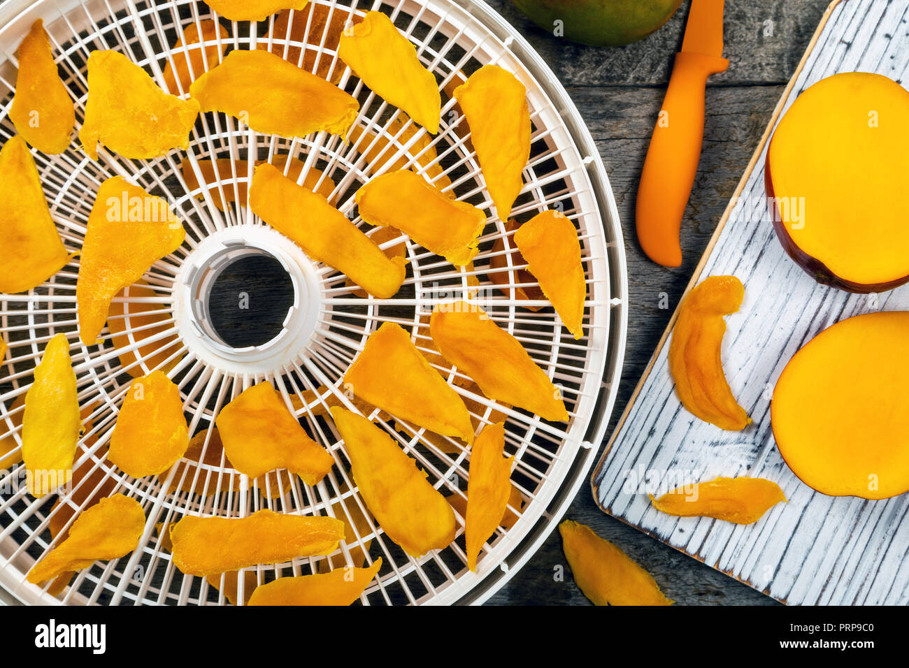 Dried Mango Fruit on a Dehydrator Rack Stock Photo Alamy
