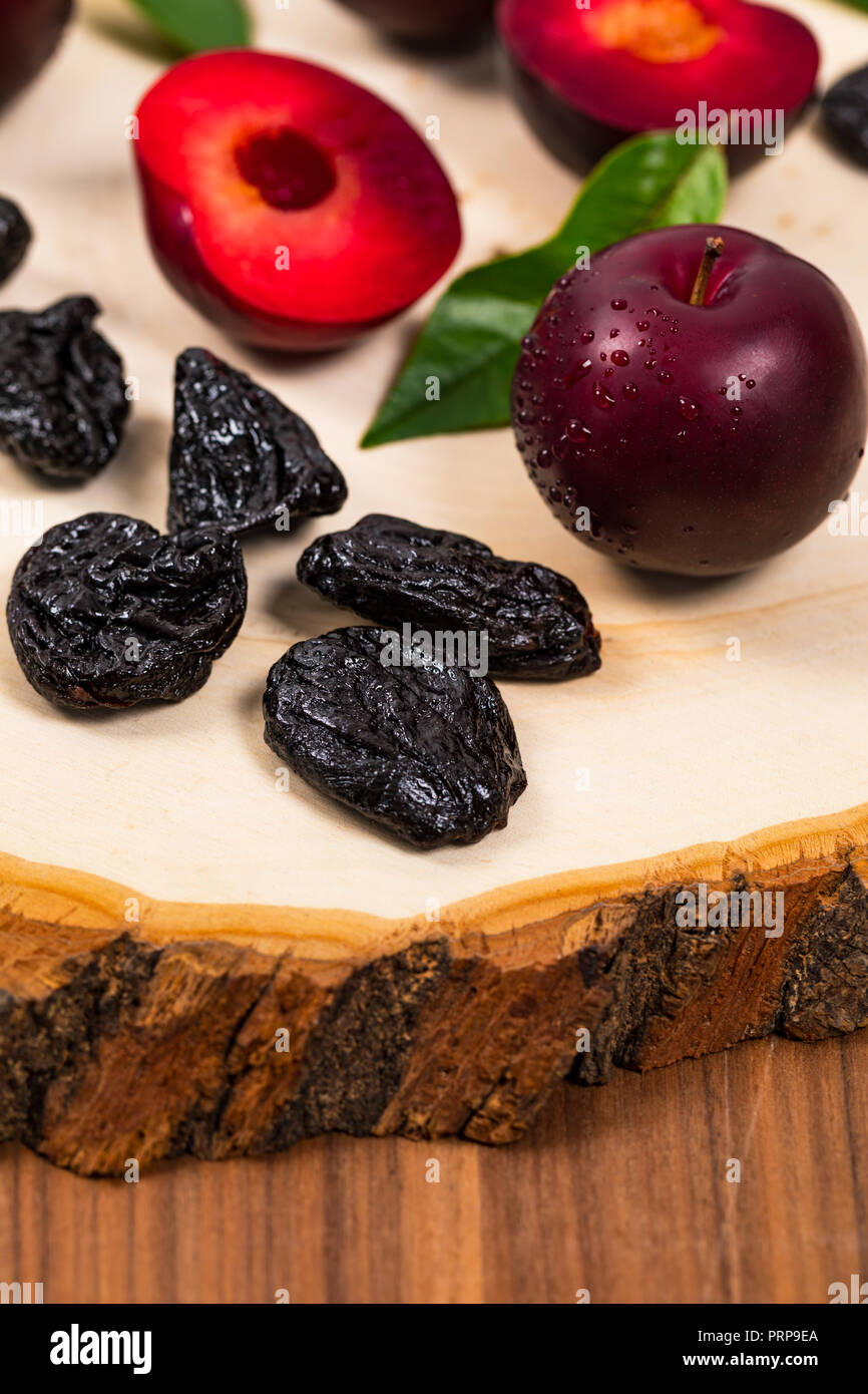 Dried Plums Pitted Prunes and Fresh Plums Background Stock Photo Alamy